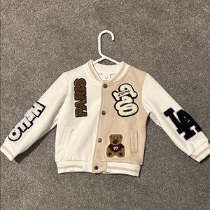 White and Tan Varsity Jacket with Patches